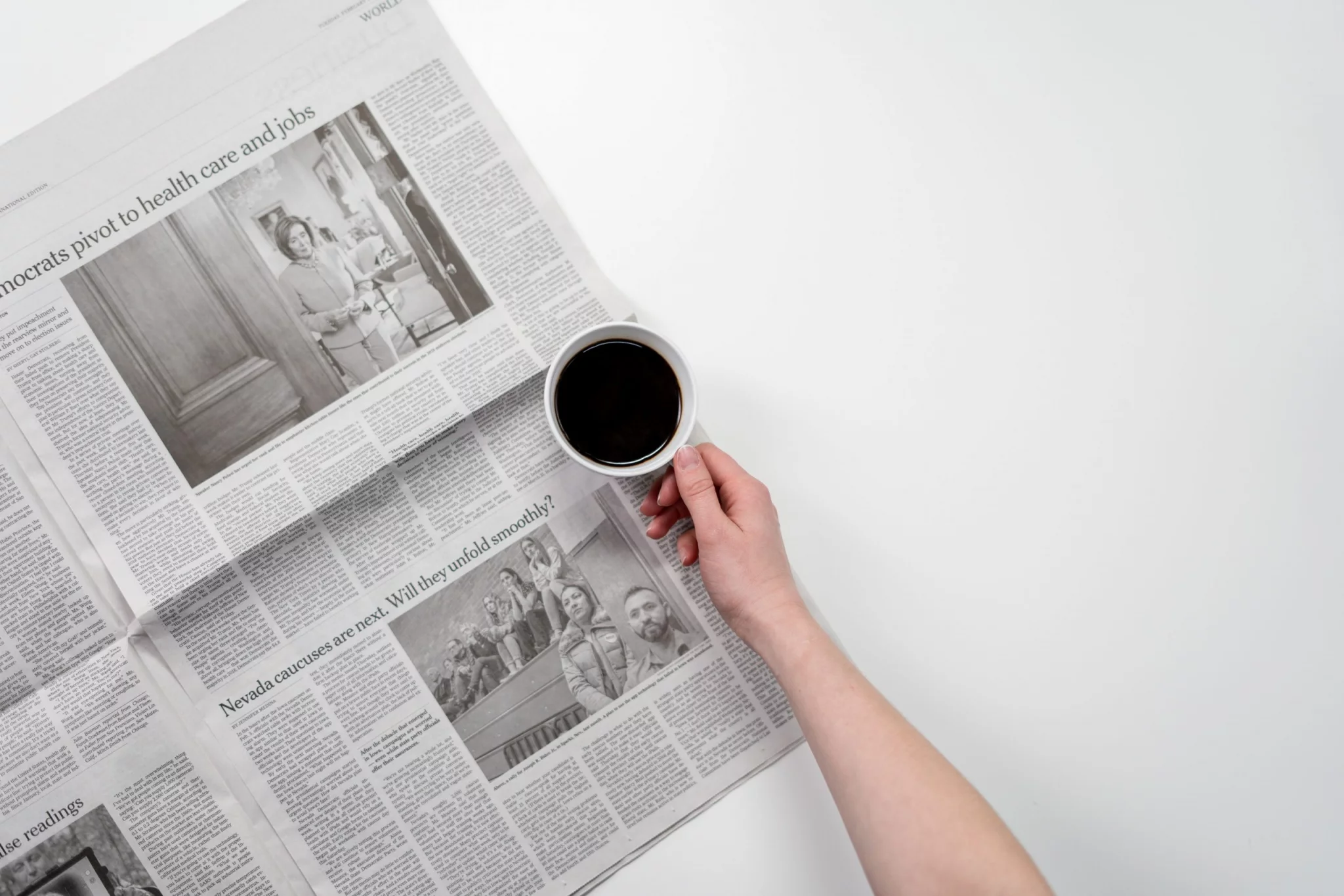 Newspaper and coffee cup